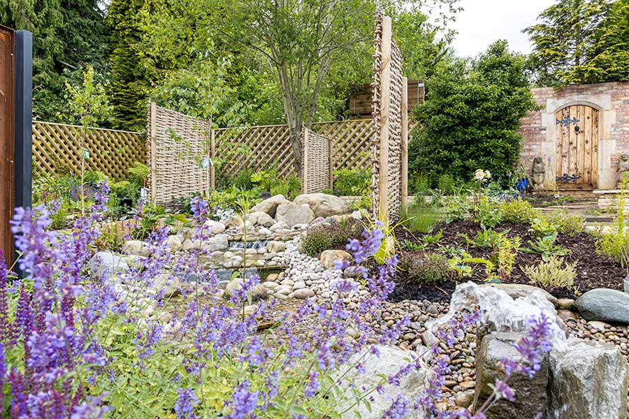 Extensive planting and a central water feature can be seen in the Feature Garden at Oxford Garden Centre