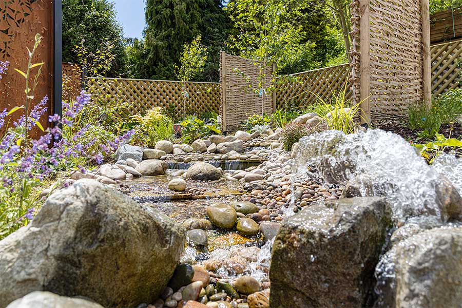 A view of the rockery water feature in the Feature Garden at Oxford Garden Centre